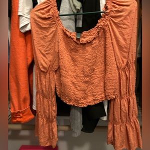 Orange puffy sleeve cropped top